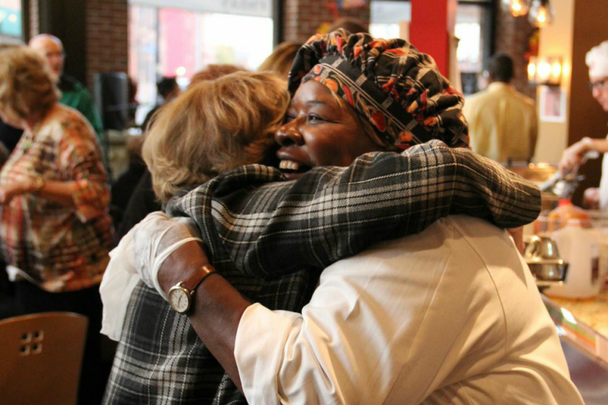 Louise Slaughter hugging a woman 