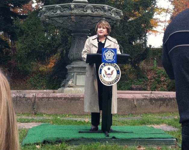 Louise Slaughter speaking at Mt. Hope cemetery in front of the Florentine fountain